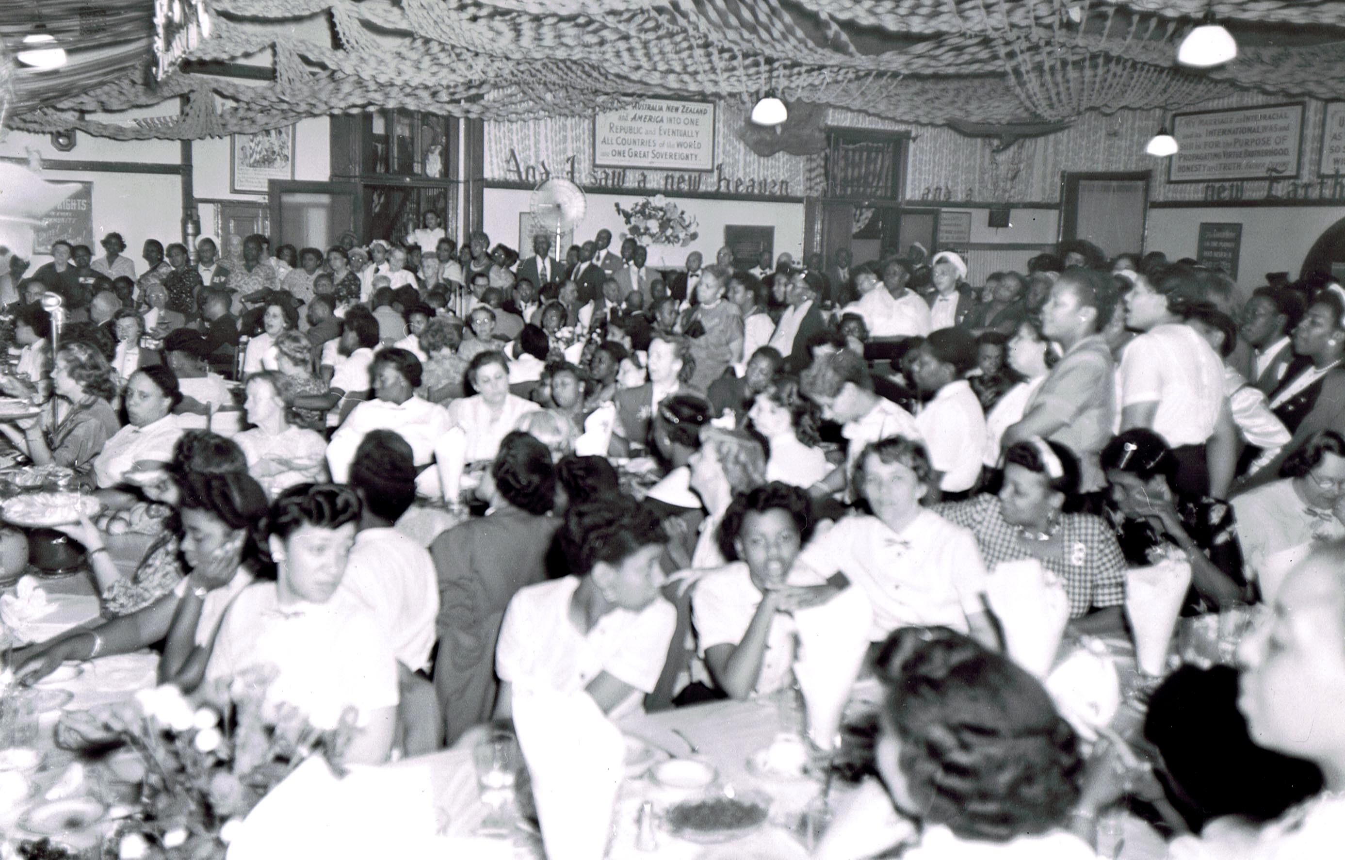 Children being served at the banquet tableof The Unity Mission Church, Home and Training School.