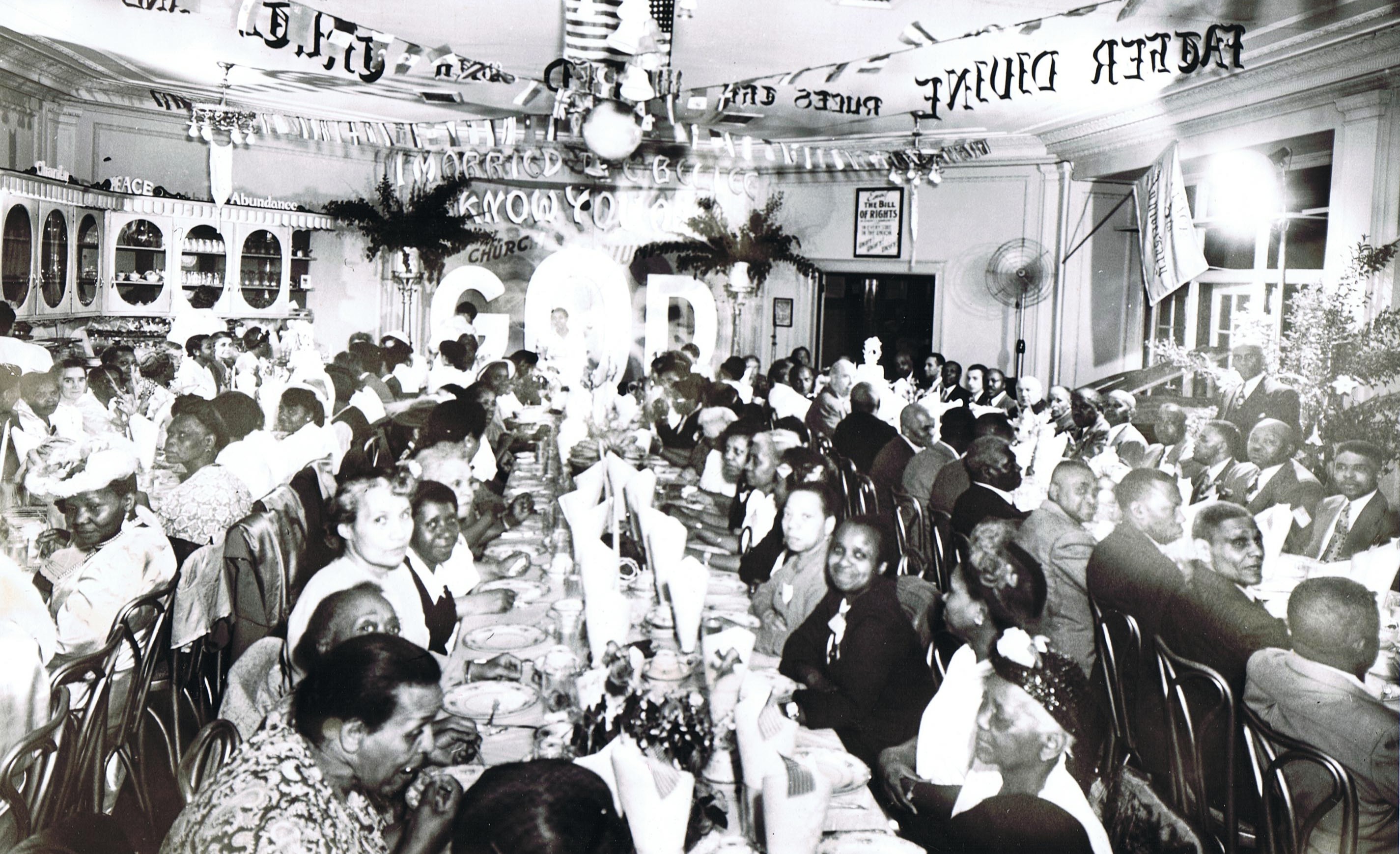 Followers and guests dining at The Divine Riviera Hotel, Newark, N.J.