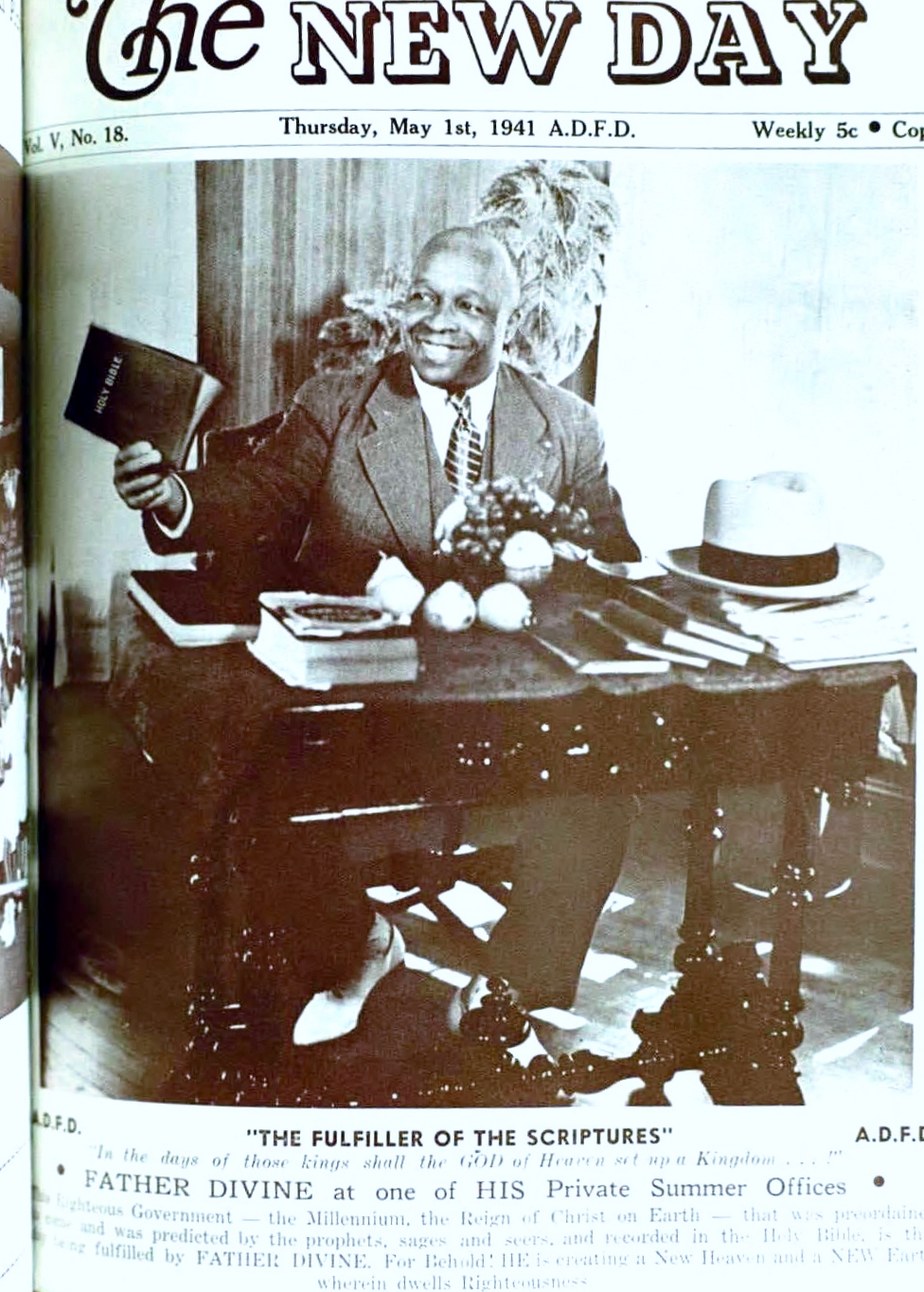 FATHER DIVINE at His office desk.