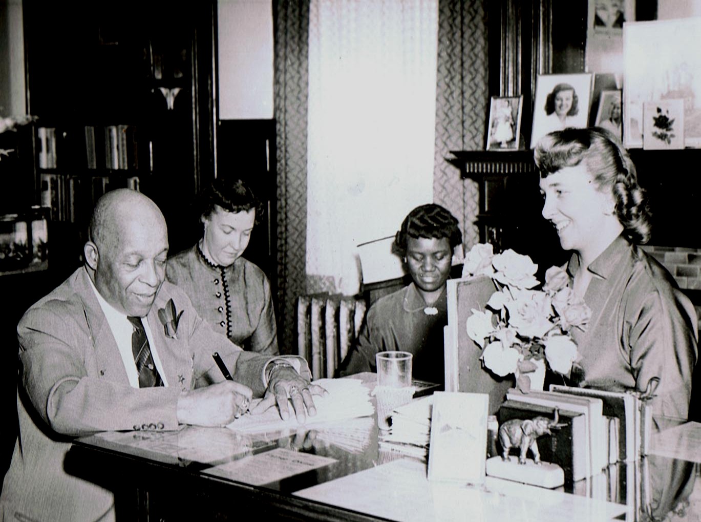FATHER and MOTHER DIVINE with some of the Secretaries.