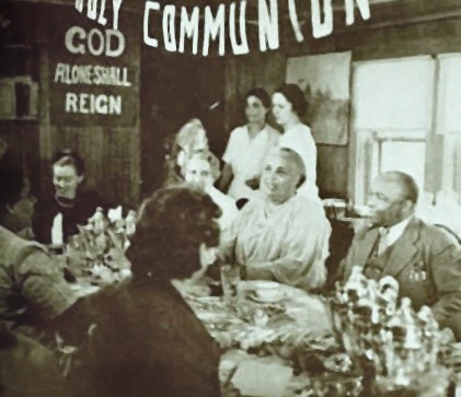 Father and Penninah Divine Serving the Holy Communion Table at Hope Farm, Ulster County,
New York